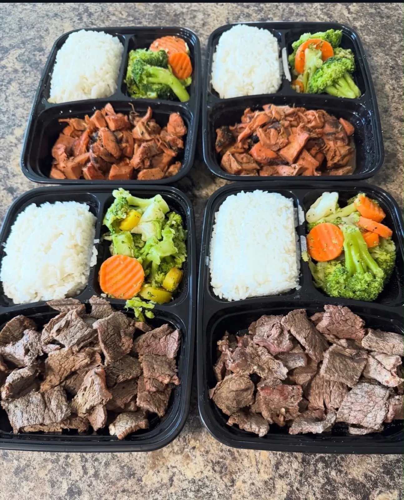 Fresh meal prep containers with protein, rice and vegetables